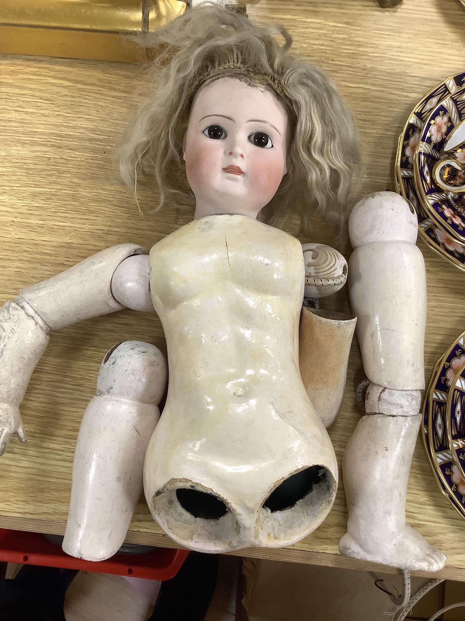 An early 20th century Lanternier & Cie, Limoges France bisque head doll, Cherie no. 11 and a another bisque head doll marked 13, limbs incomplete